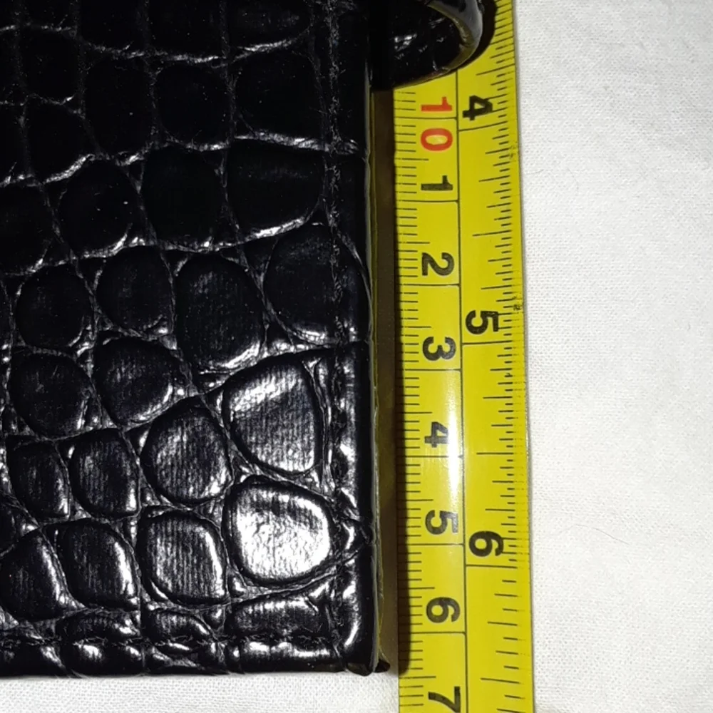 Black 6 ring planner 6.5 x 10.5 Faux leather snake style pattern. New.